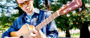 Southern Oregon University Music Student Playing Guitar