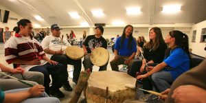 Native American Studies Student in Class Drum Circle