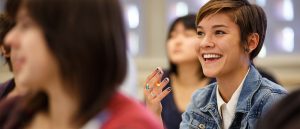 Female Student Smiling During Class