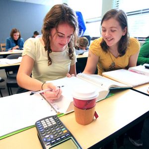 Two Business Students Working on In-class Assignment