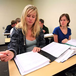Two Female Students Working on Assignment
