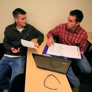 Two Students Working on Assignment in Class