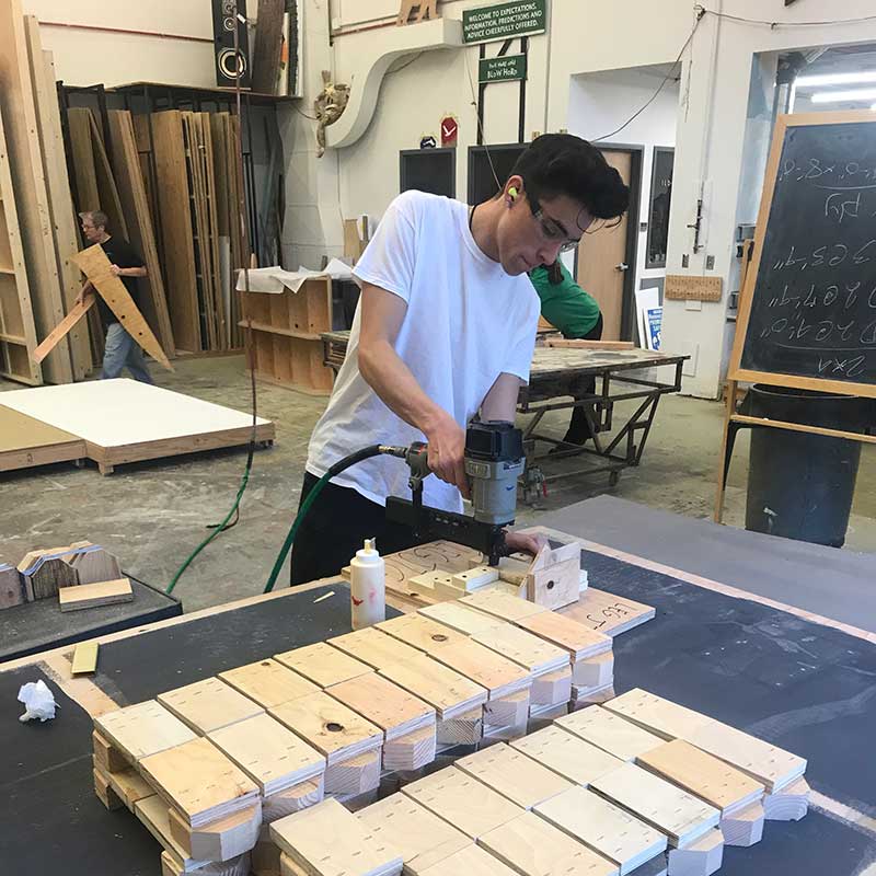 Student Working with wood in Production Fabrication