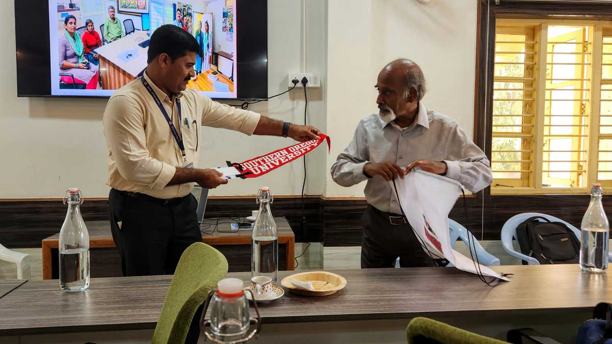 Dr Prakash Chenjeri presenting SOU gifts to the Gram Panchayat