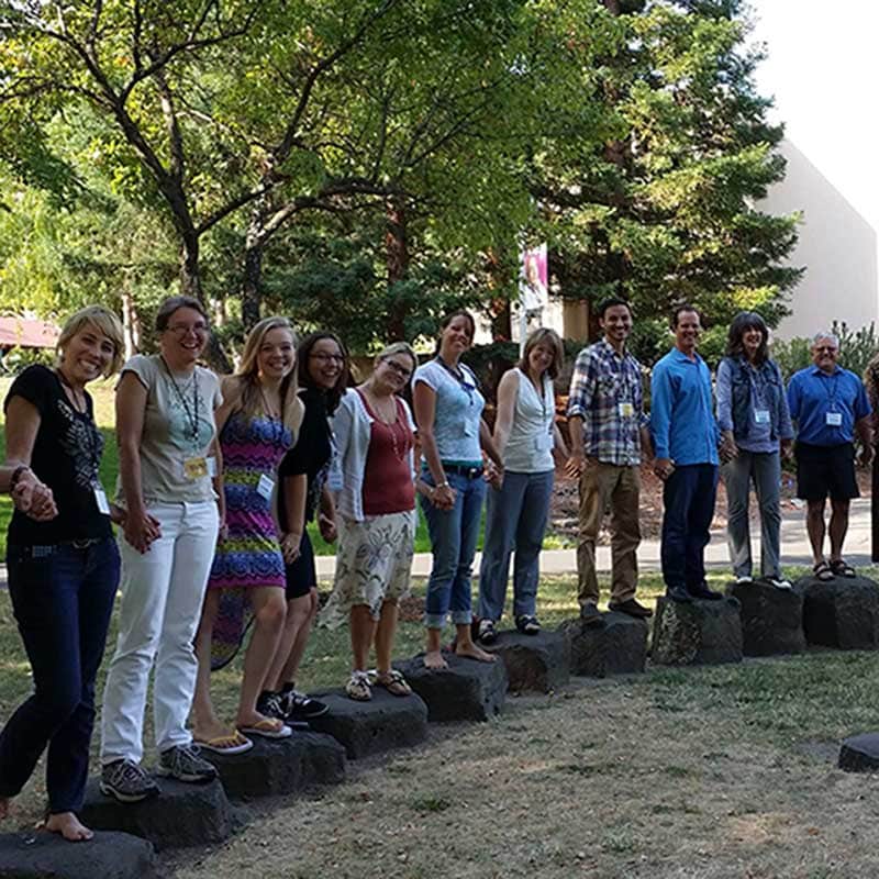 Certificate in Holistic Education Standing on stones together Learn More