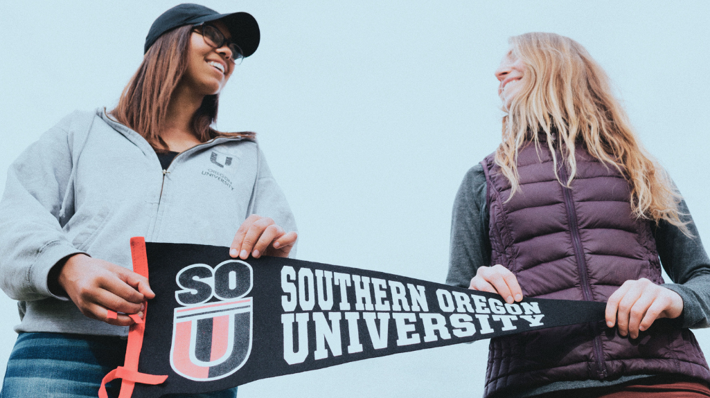 Students with SOU pennant