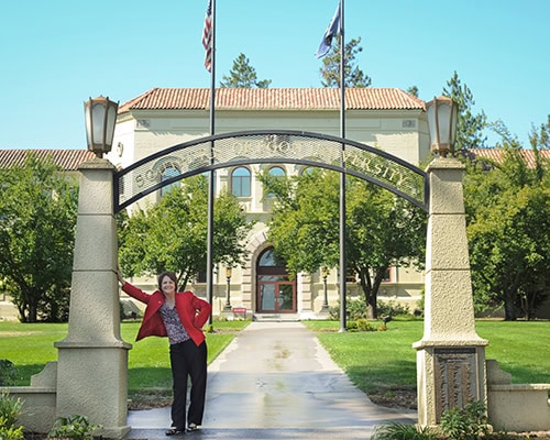 SOU President Linda Schott at the Churchill Hall Arch